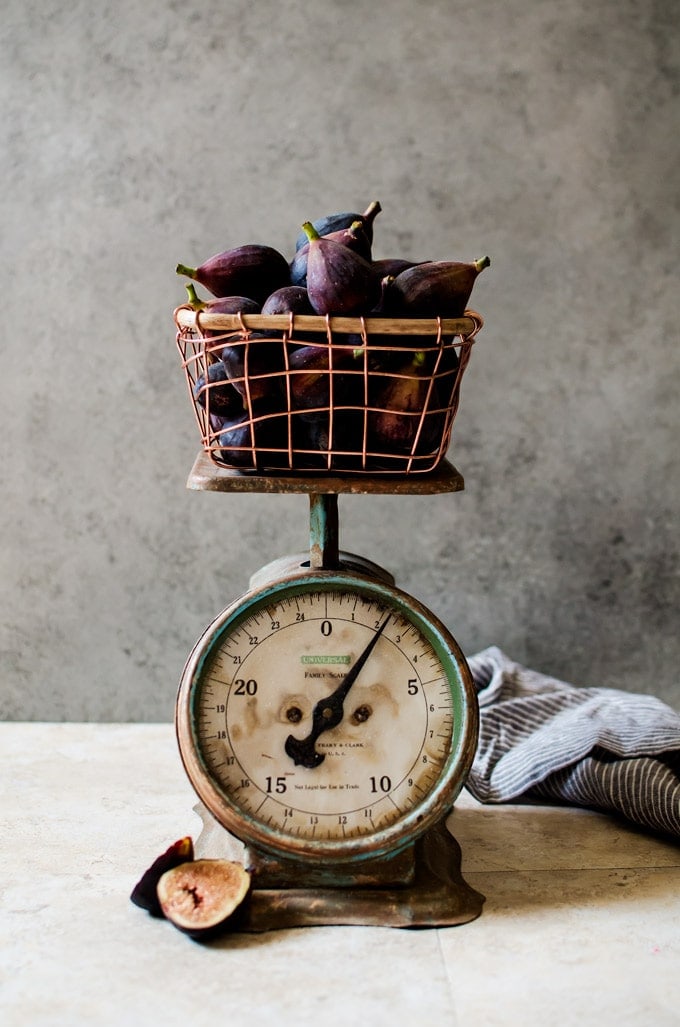 figs in backet on antique scale