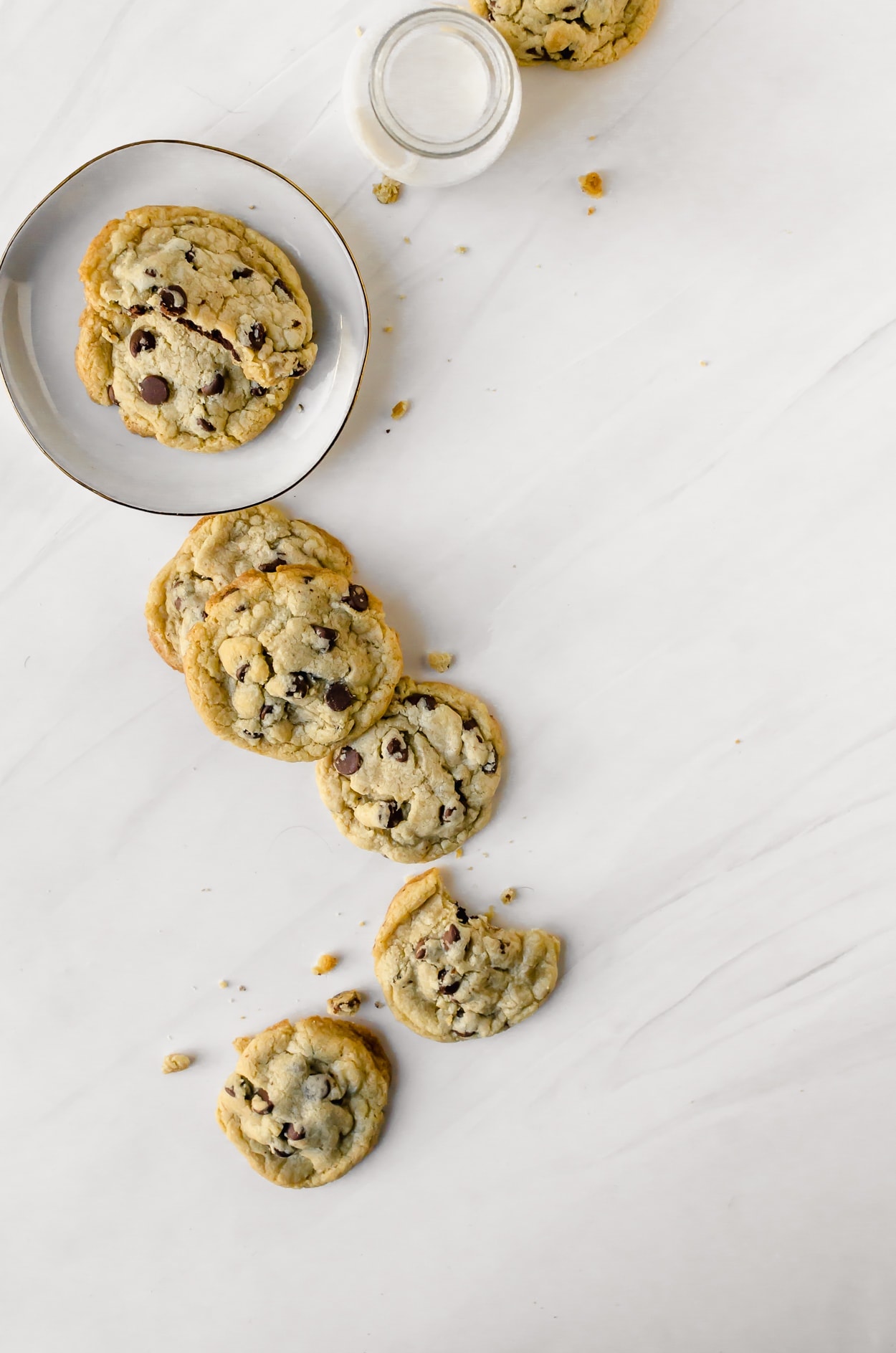 A trail of brownie stuffed chocolate chip cookies overhead shot