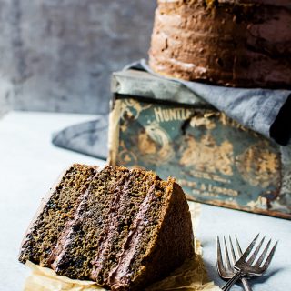 Coffee flavored cake with whipped mocha ganache sliced on parchment