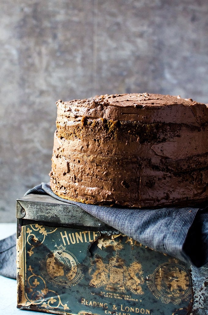 Coffee flavored cake on antique cake stand close up