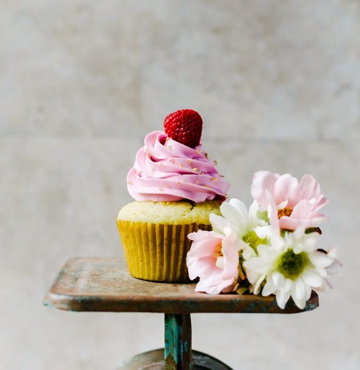 Champagne cupcakes with passionfruit curd and raspberry champagne swiss meringue buttercream