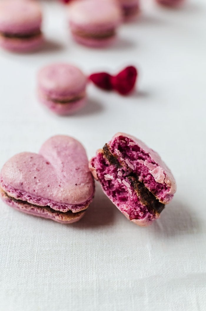 Sweet, raspberry macarons with a smooth chocolate ganache. These macarons will be your favorite new cookie