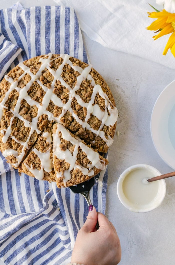 A delicious cinnamon roll coffee cake with extra crumb topping and cream cheese frosting