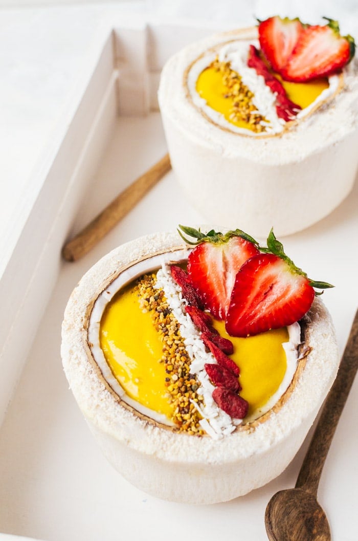 A vibrant mango turmeric smoothie bowl recipe that will put a smile on your face all morning long