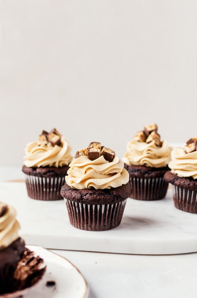 Grab a napkin and glass of milk and chow down on a couple of these snickers cupcakes