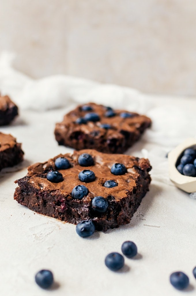 Fudgy blueberry brownies make the most irresistible dessert, especially topped with a big scoop of ice cream! 