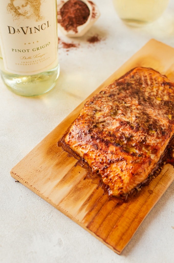 A flaky barbecue cedar plank grilled salmon with grilled veggies. Is there anything better