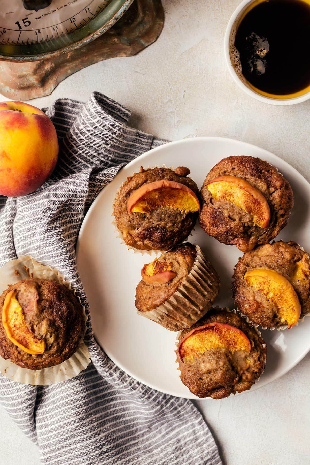 These fluffy cinnamon peach muffins are like a peach cobbler you can have for breakfast