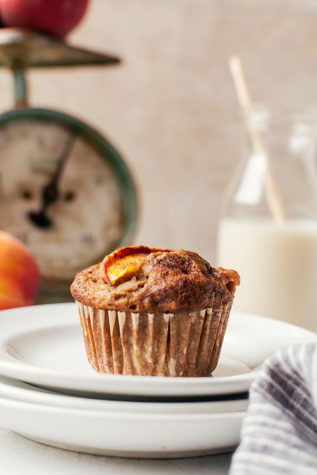 Tender and moist cinnamon peach muffins that will make every summer morning the best