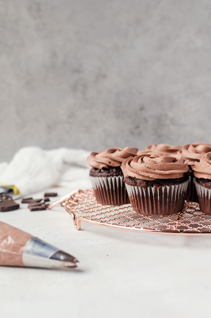 Decadent brownie muffins topped with airy chocolate whipped cream