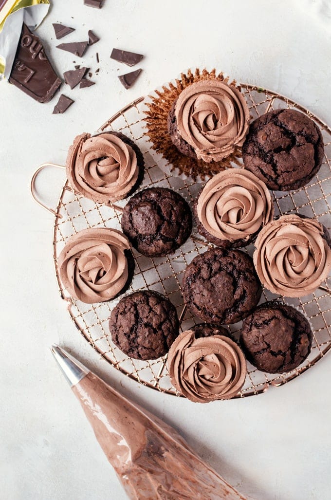 Decadent brownie muffins topped with light chocolate whipped cream