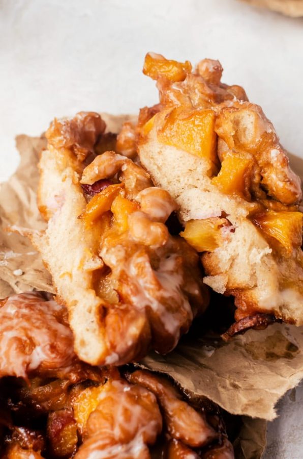 These cinnamon infused peach fritters and maple glaze will be your new favorite way to start the day
