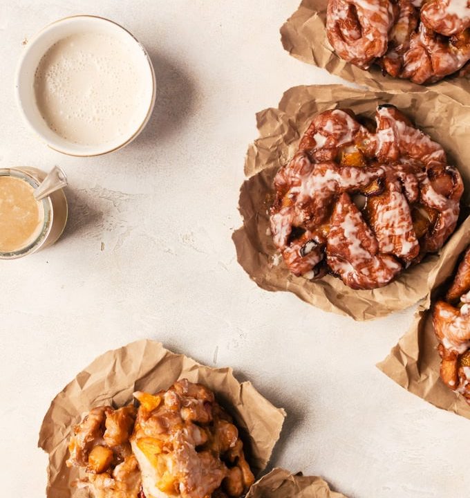 Irresistible peach fritters with maple glaze. There is nothing better than waking up to one of these in the morning