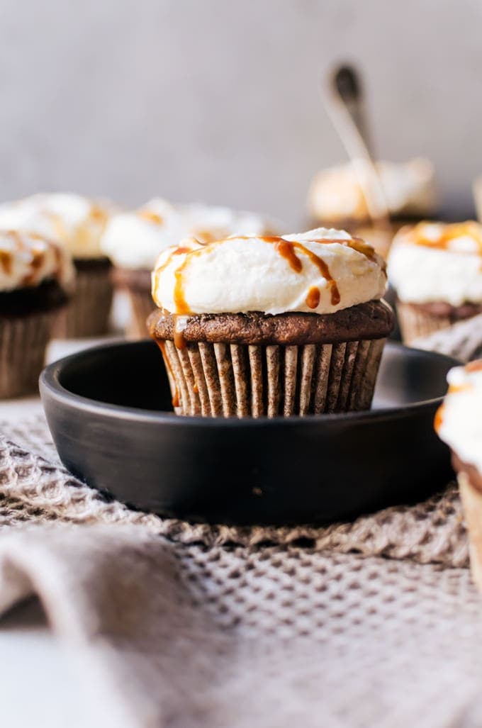 The perfect balance of coffee and pumpkin spice meet in an irresistible cupcake topped with airy whipped cream and finished with caramel