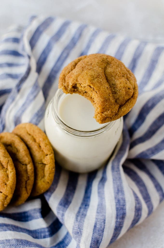 Cookie over top glass of milk