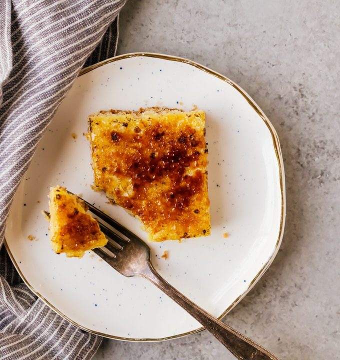 Super citrusy bruleed lemon bars with a crisp bruleed topping. The perfect easy and cozy treat