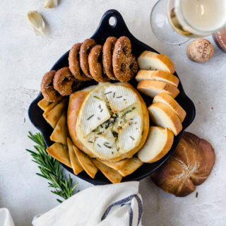 Warm, gooey rosemary garlic baked brie inside a crusty loaf of bread. It doesn't get any better than this