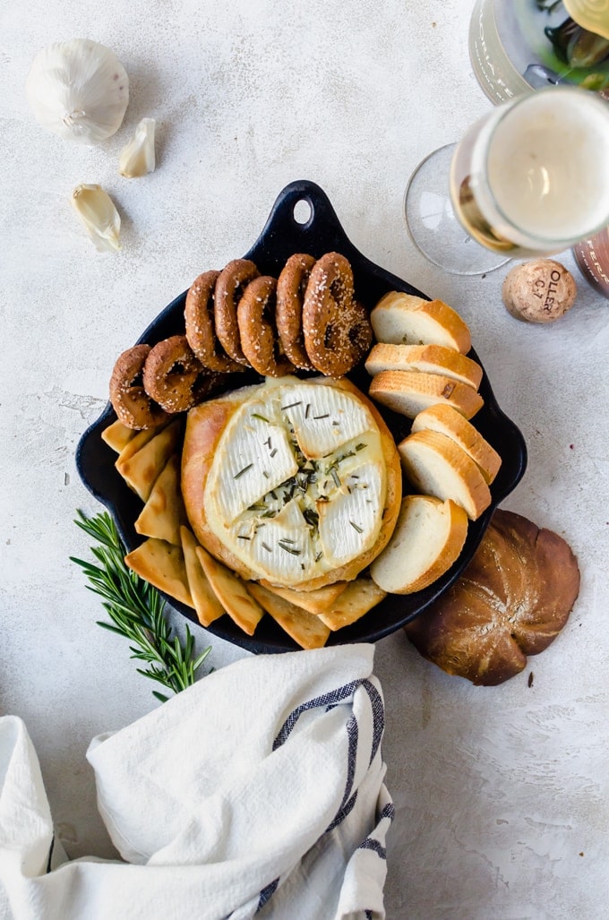 Warm, gooey rosemary garlic baked brie inside a crusty loaf of bread. It doesn't get any better than this