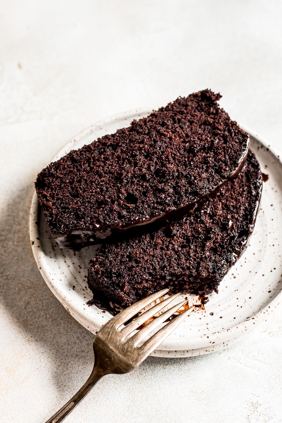 slices of cake on plate with bite missing