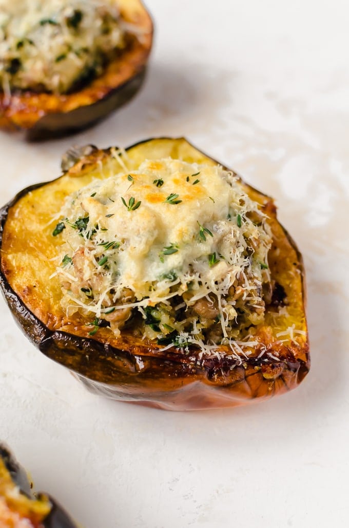 close up of turkey stuffed acorn squash with melted cheese