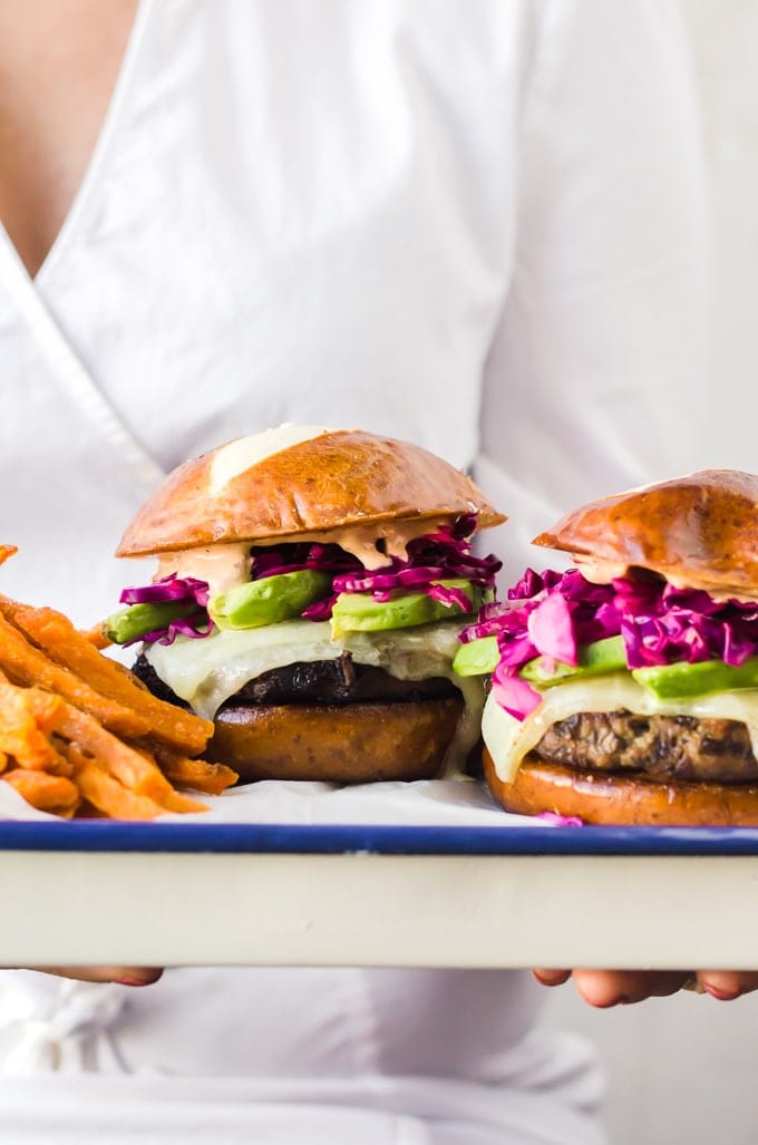 Juicy turkey burgers on a tray served with sweet potato fries
