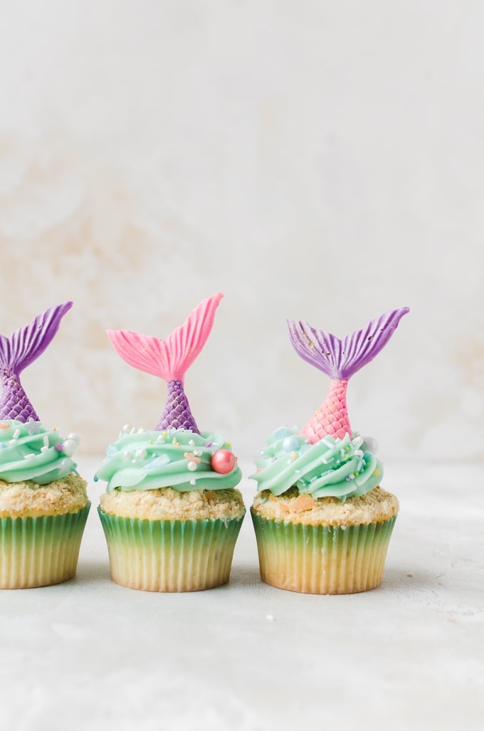 three mermaid cupcakes in a row