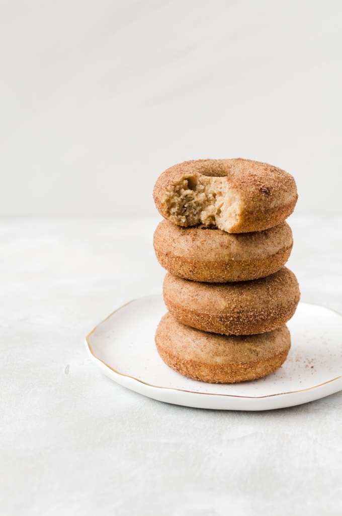 stack of baked churro doughnuts on a plate