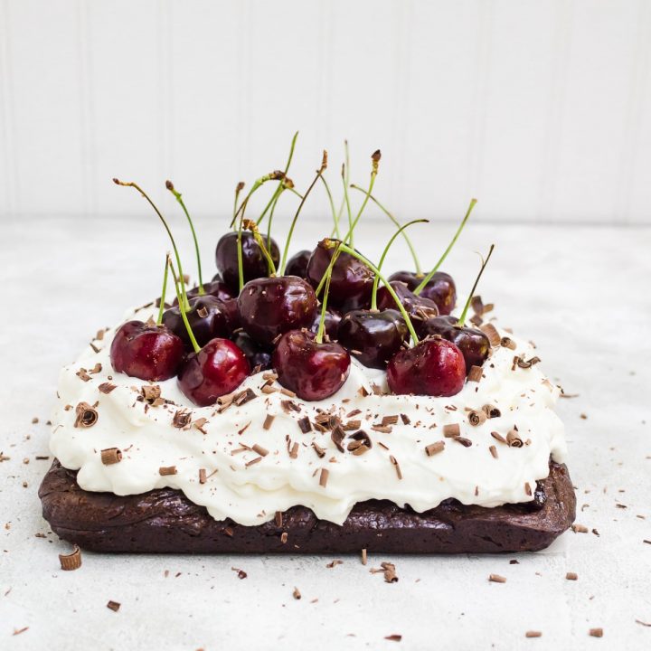Black forest brownies topped with fresh cherries