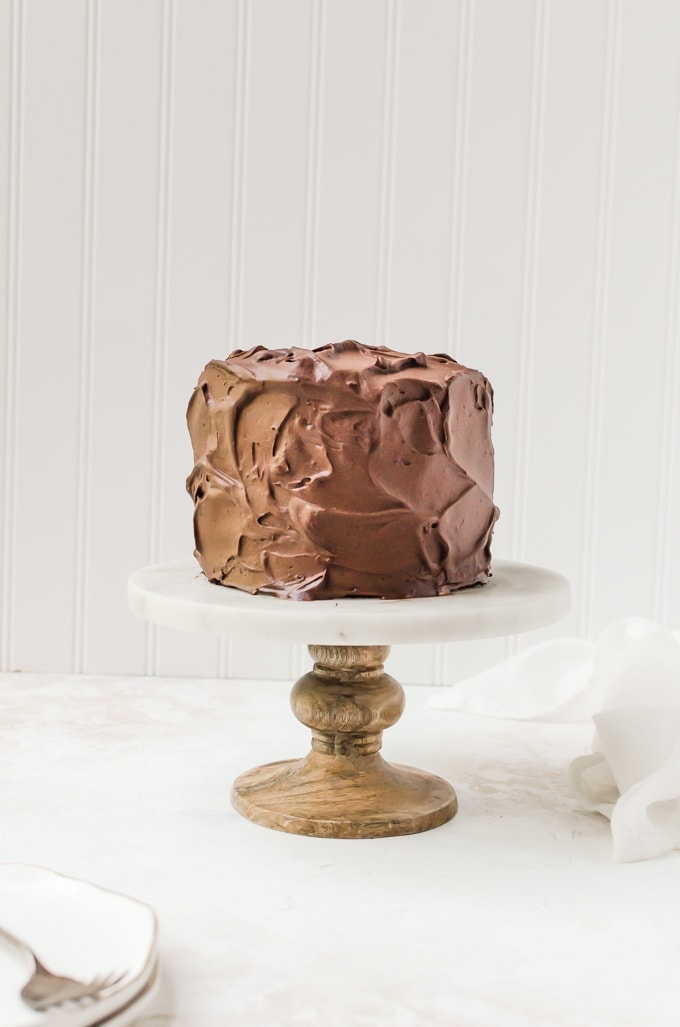 old-fashioned chocolate cake on a cake stand