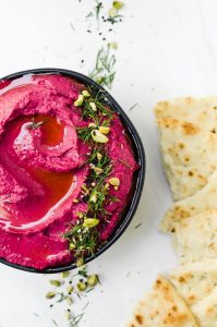 This roasted beet hummus is as flavorful as it is beautiful