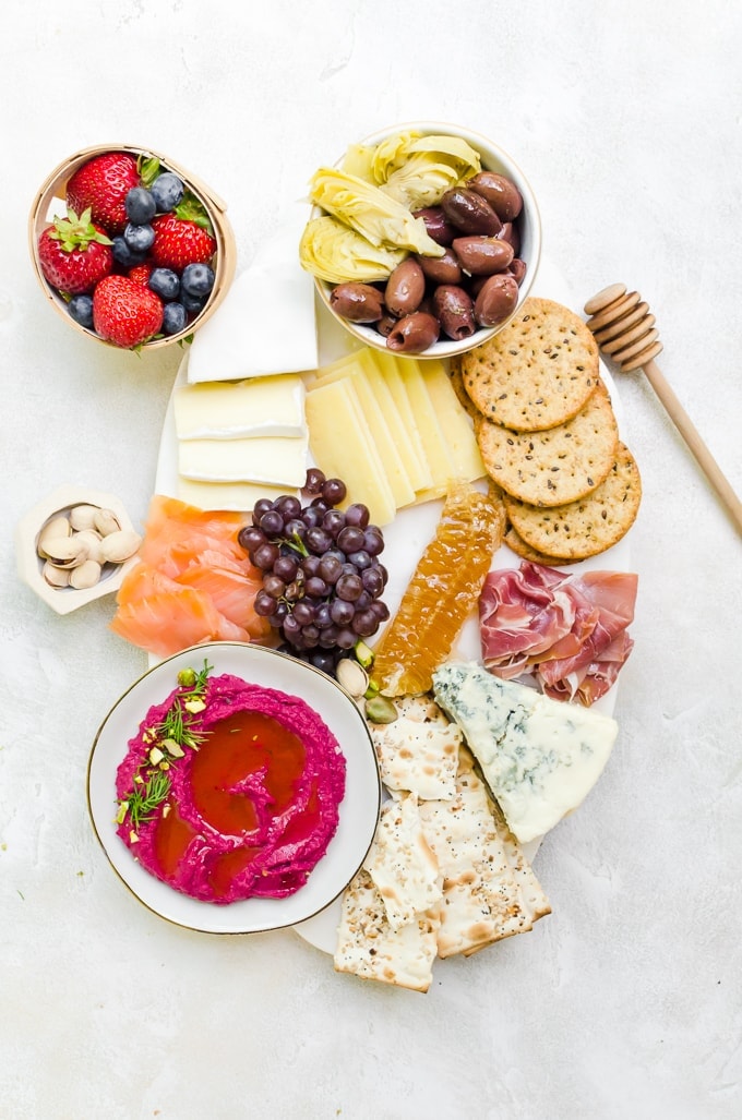 an elegant cheeseboard inspired by food from across the world