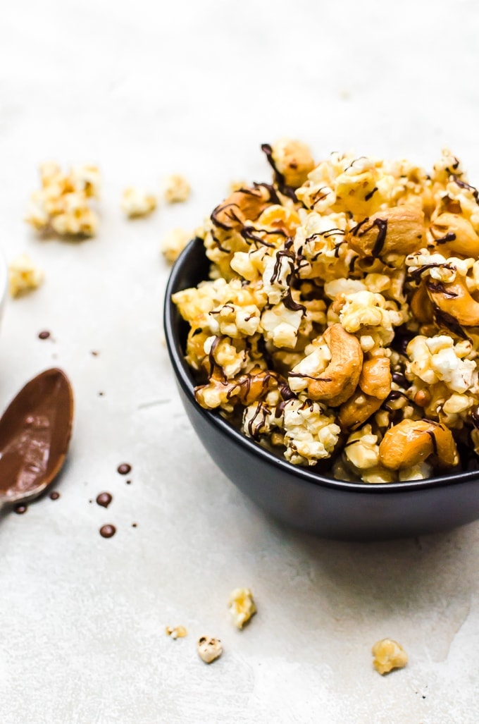 close up backlit shot of moose munch recipe in a black bowl