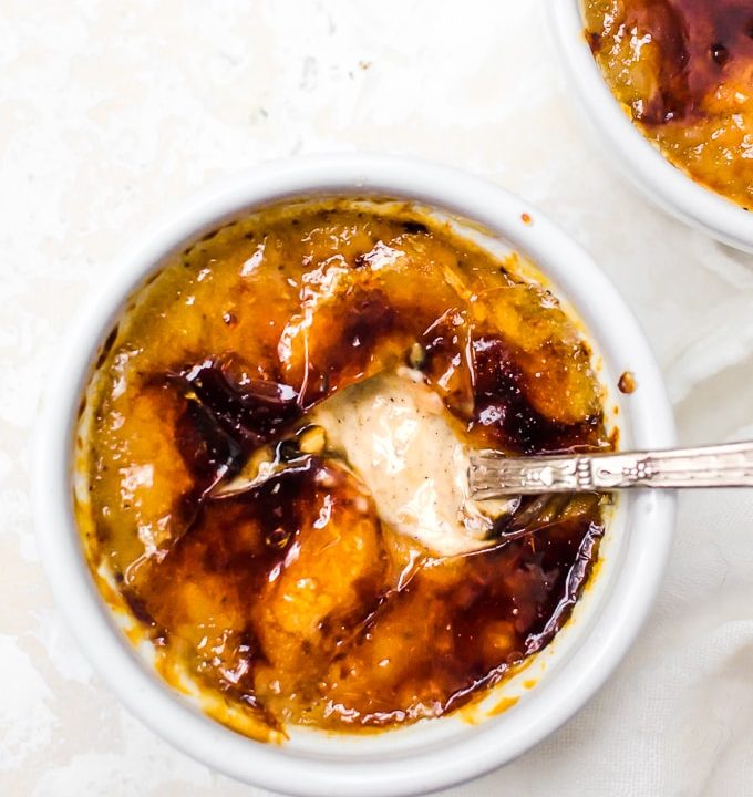 close up pumpkin creme brulee with spoon