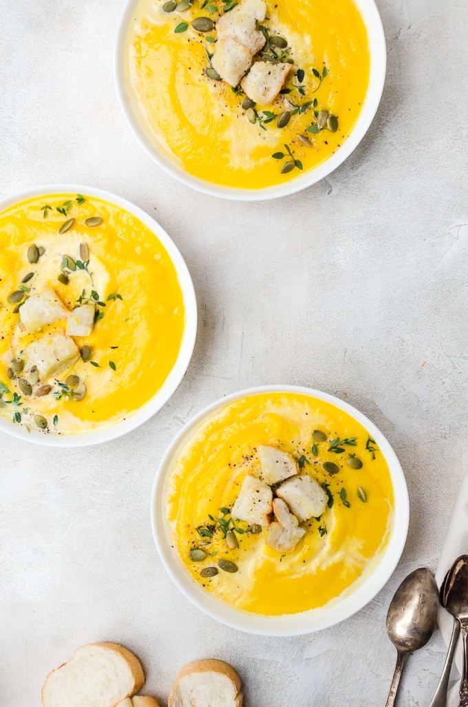 overhead shot three bowls of roasted butternut quash soup