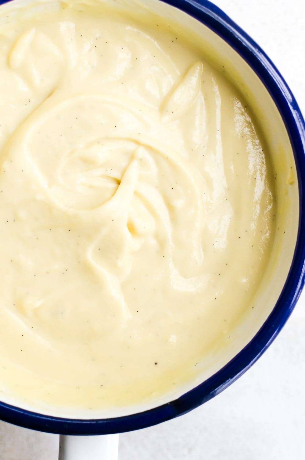 Creamy vanilla pudding recipe in a saucepan
