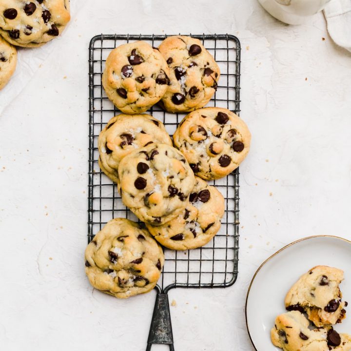 caramel stuffed chocolate chip cookies on a wire rack