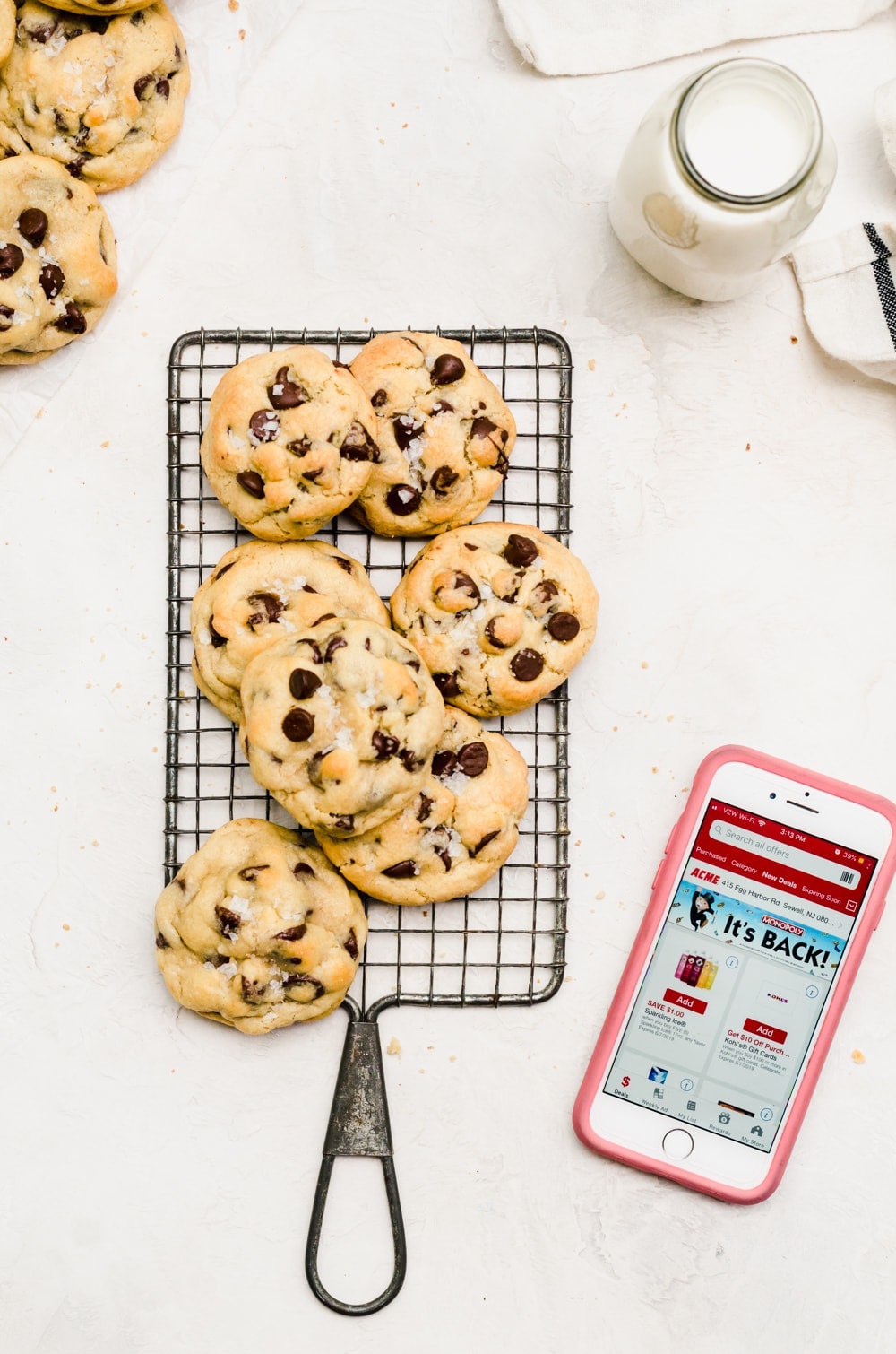 salted caramel stuffed chocolate chip cookies on wire rack with coupon