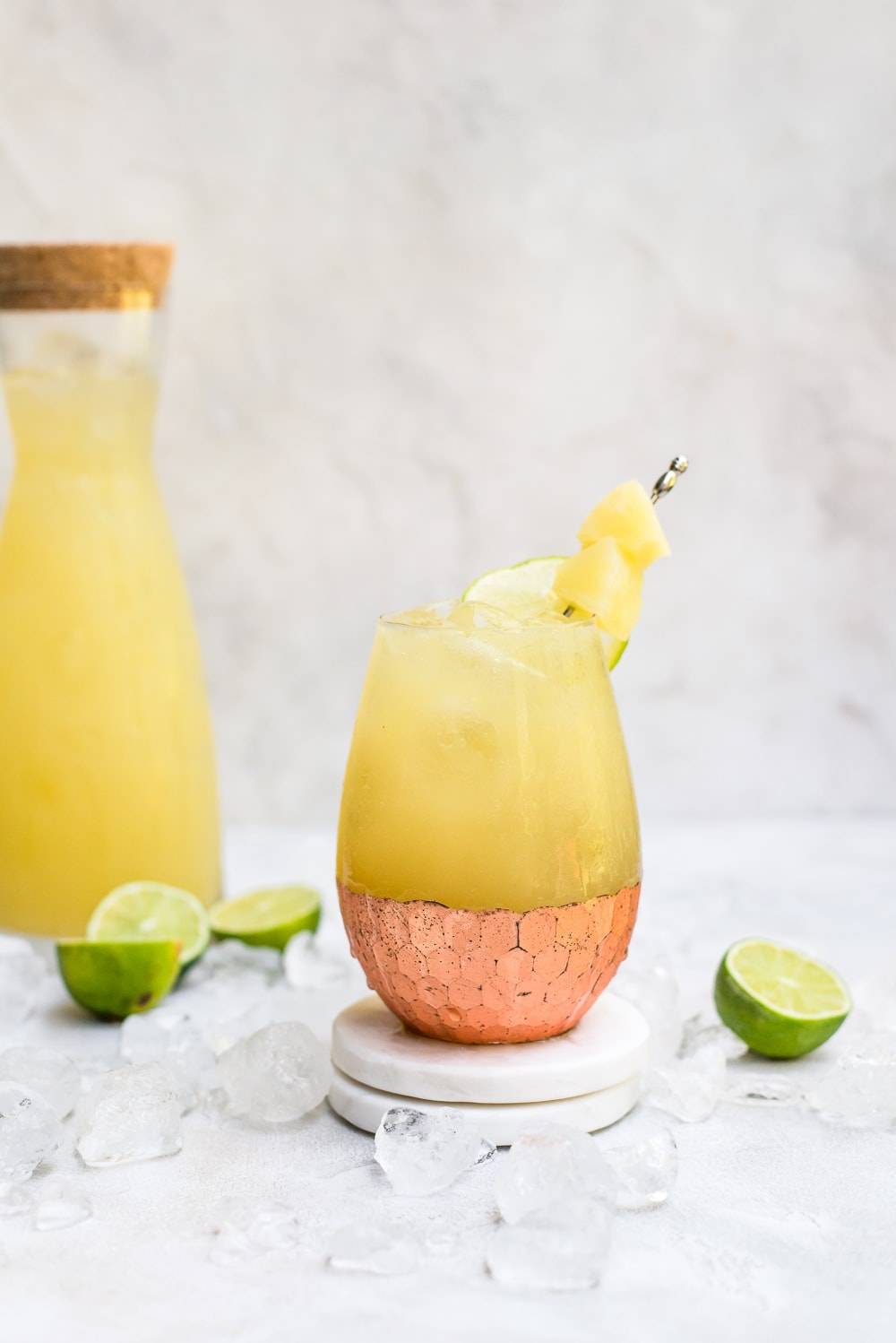 kombucha moscow mule in copper cocktail glass with pitcher of cocktail