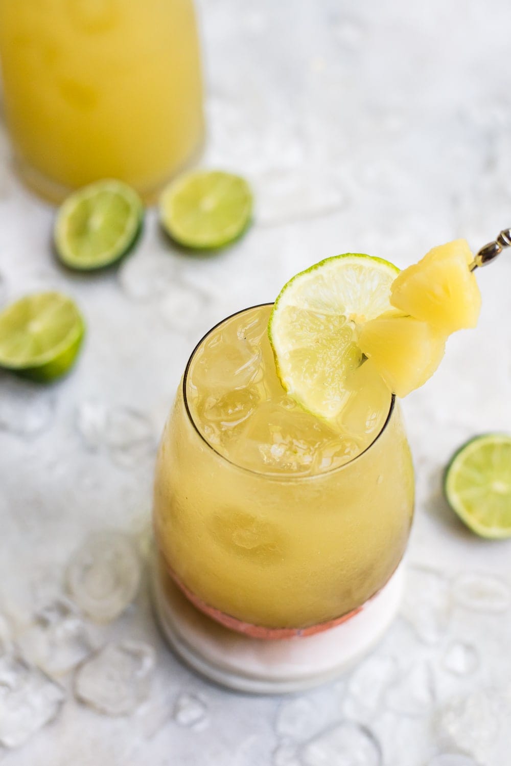 kombucha moscow mule in cocktail glass with pineapple garnish