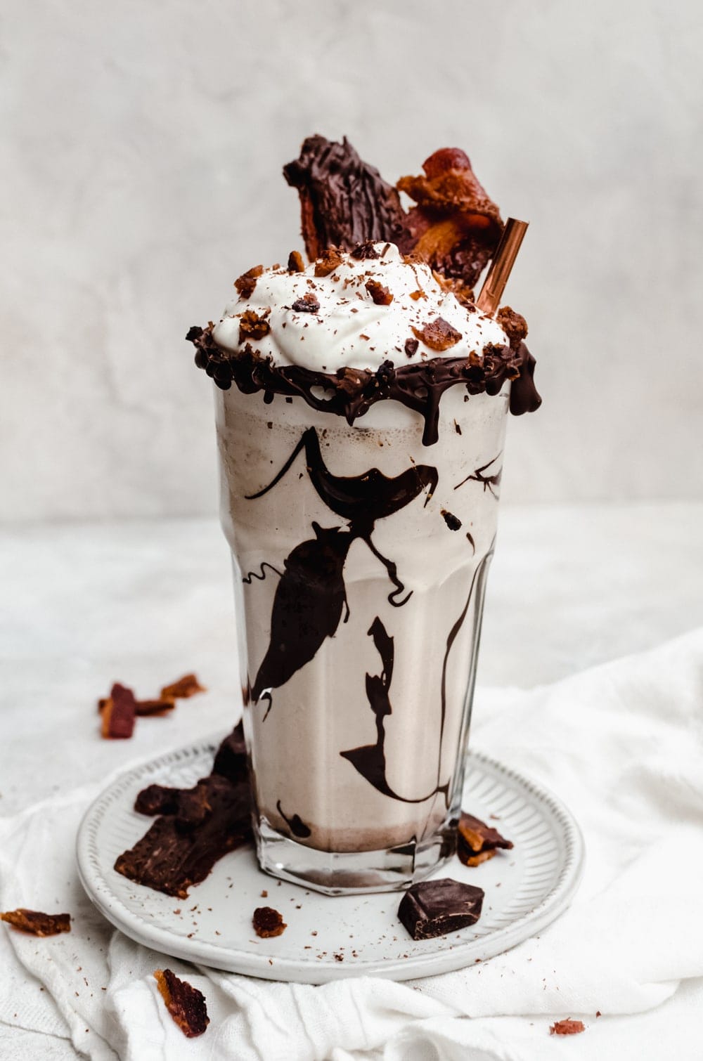 three quarter shot bacon milkshake in a glass