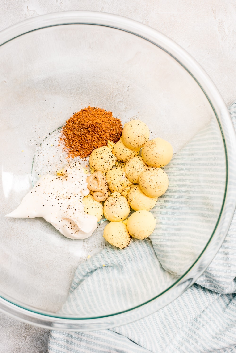 ingredients for bbq deviled eggs filling in bowl