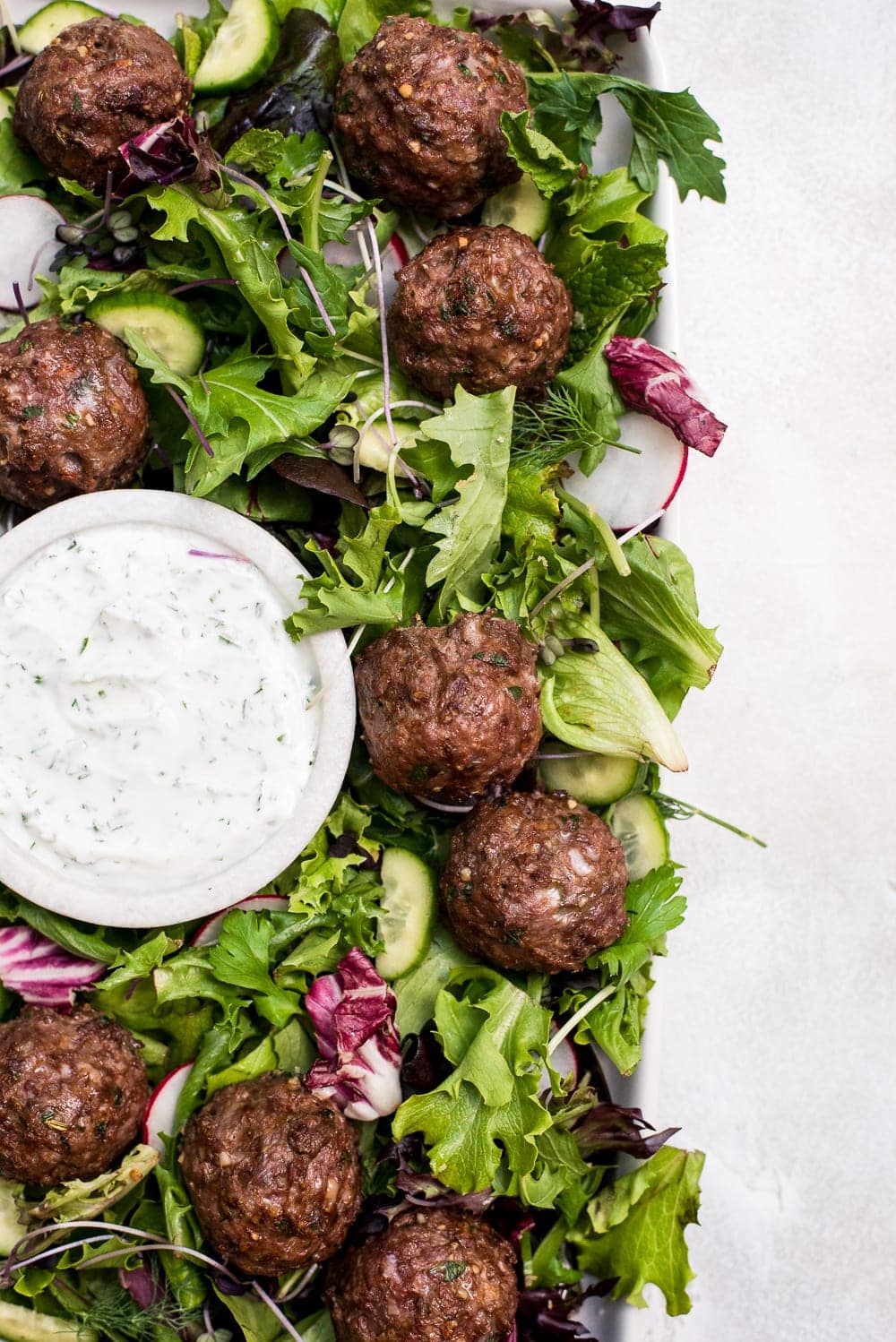 lamb meatballs in salad close up