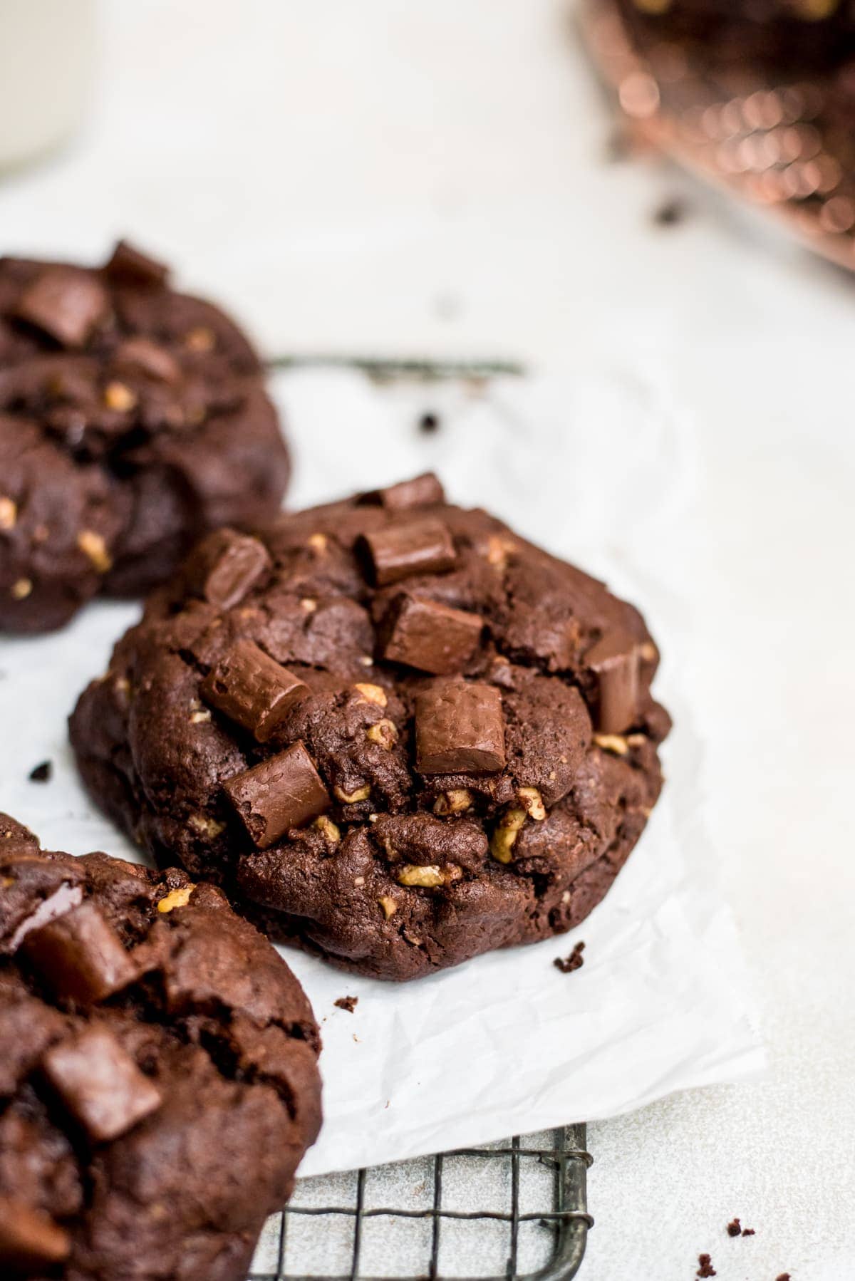 giant double chocolate chip cookie close up on wire rack