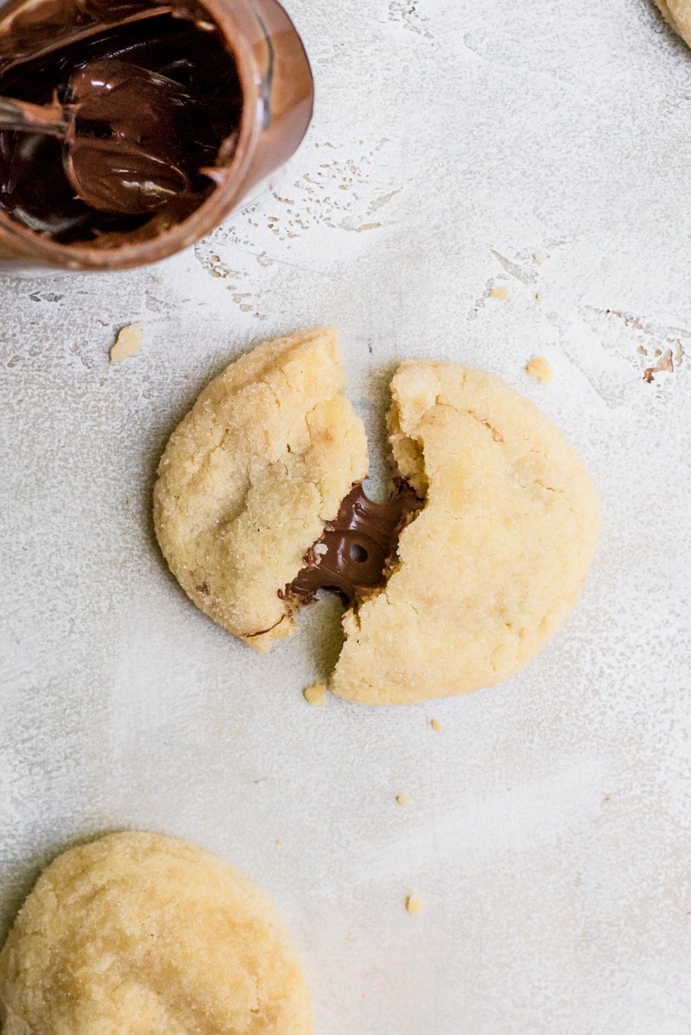 nutella stuffed sugar cookie broken and spilling nutella