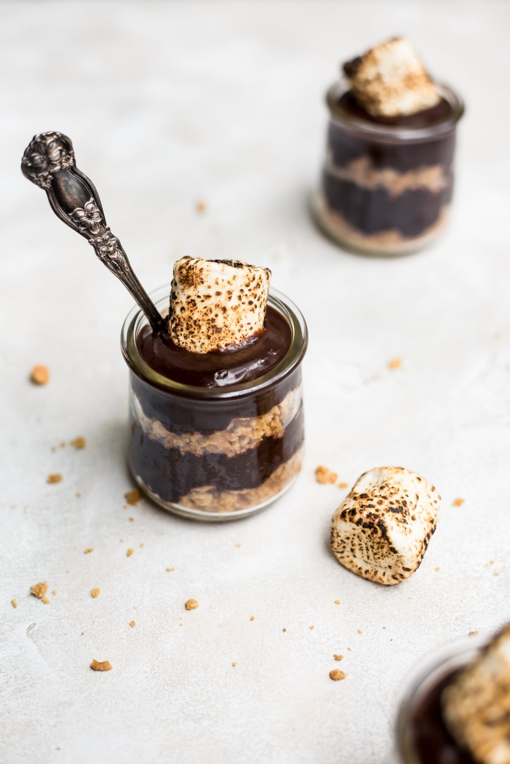 s'mores pudding with toasted marshmallow and spoon overhead