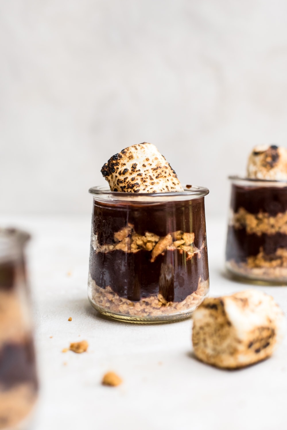 close up s'mores pudding in jar with toasted marshmallows