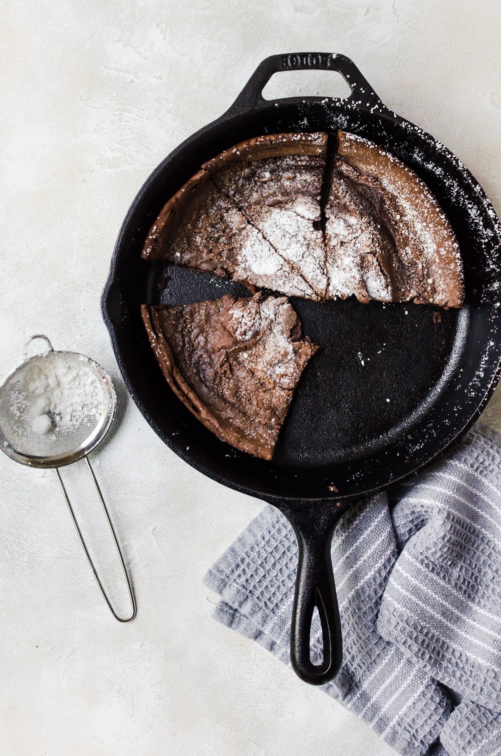 chocolate dutch baby cut in skillet