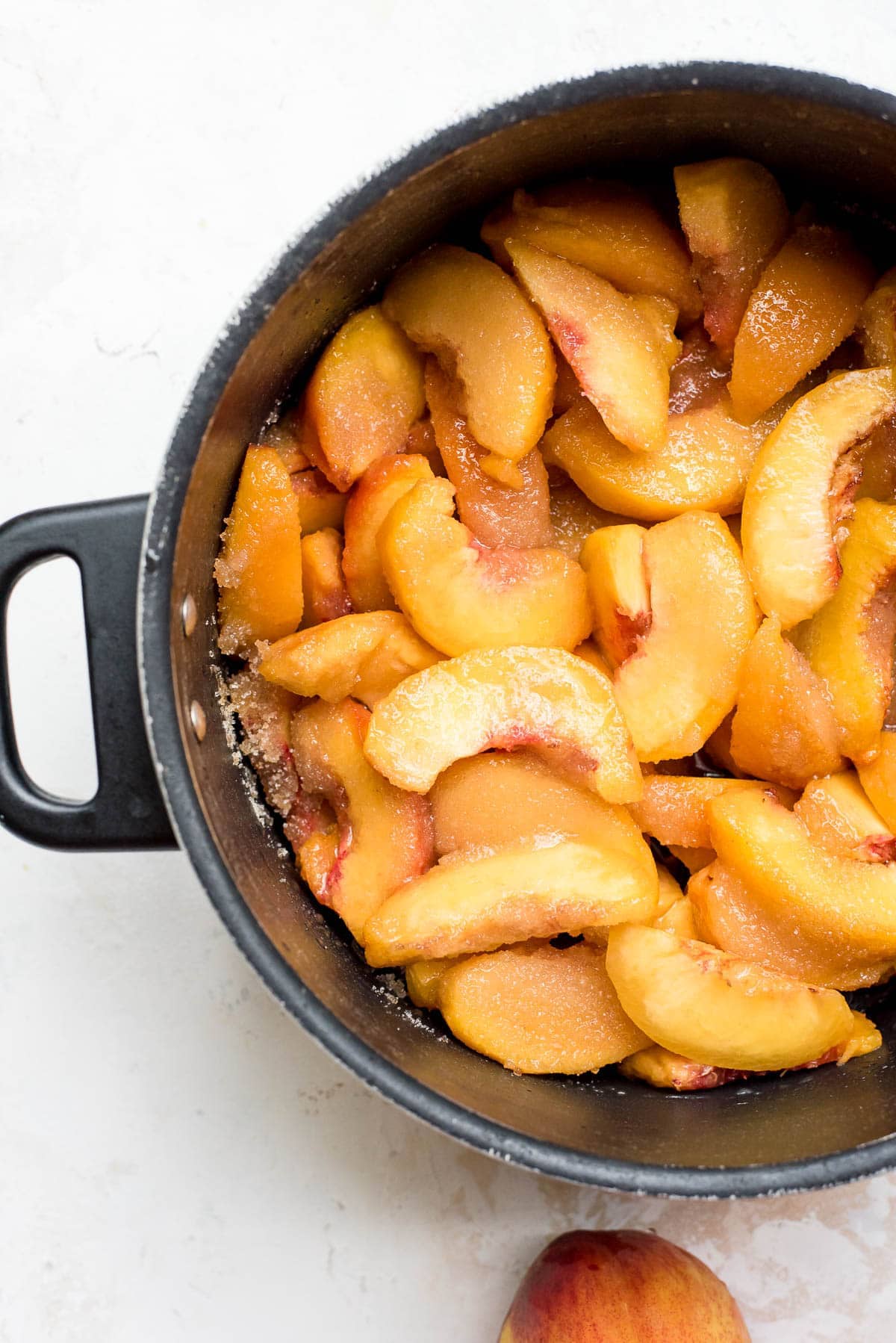 peaches mixed with sugar, lemon juice, and salt in pot