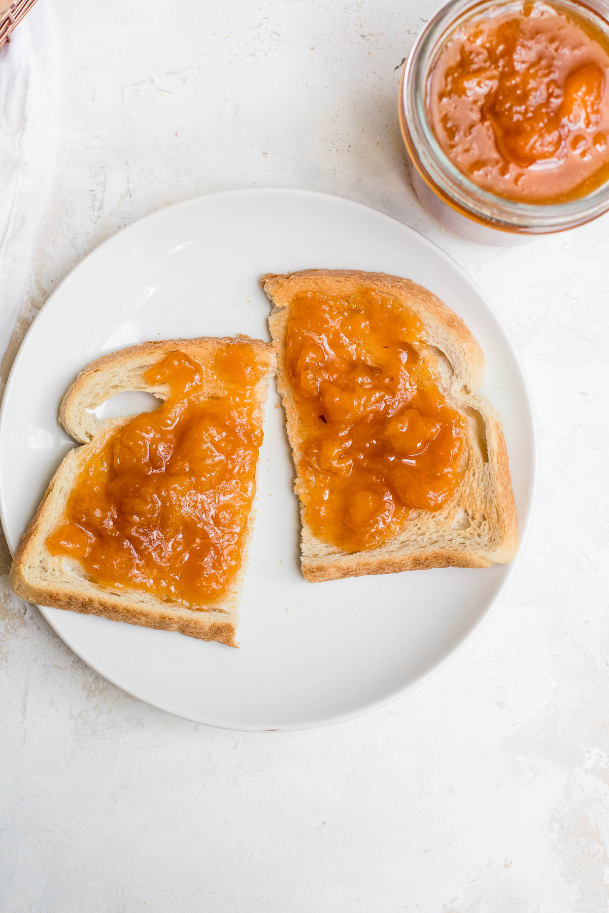 toast cut in half slathered with jam