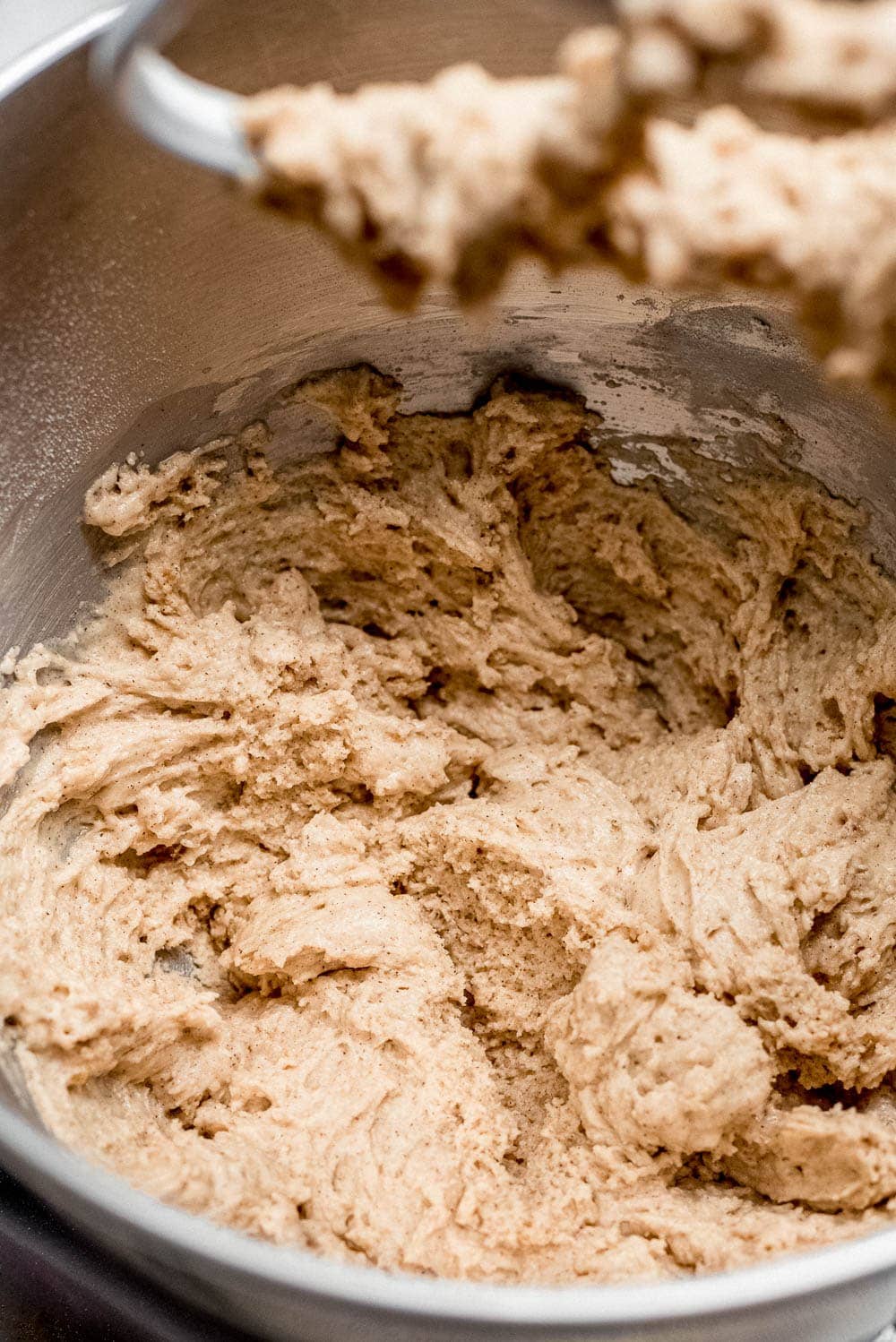 apple cider doughnuts dough in mixer close up detail